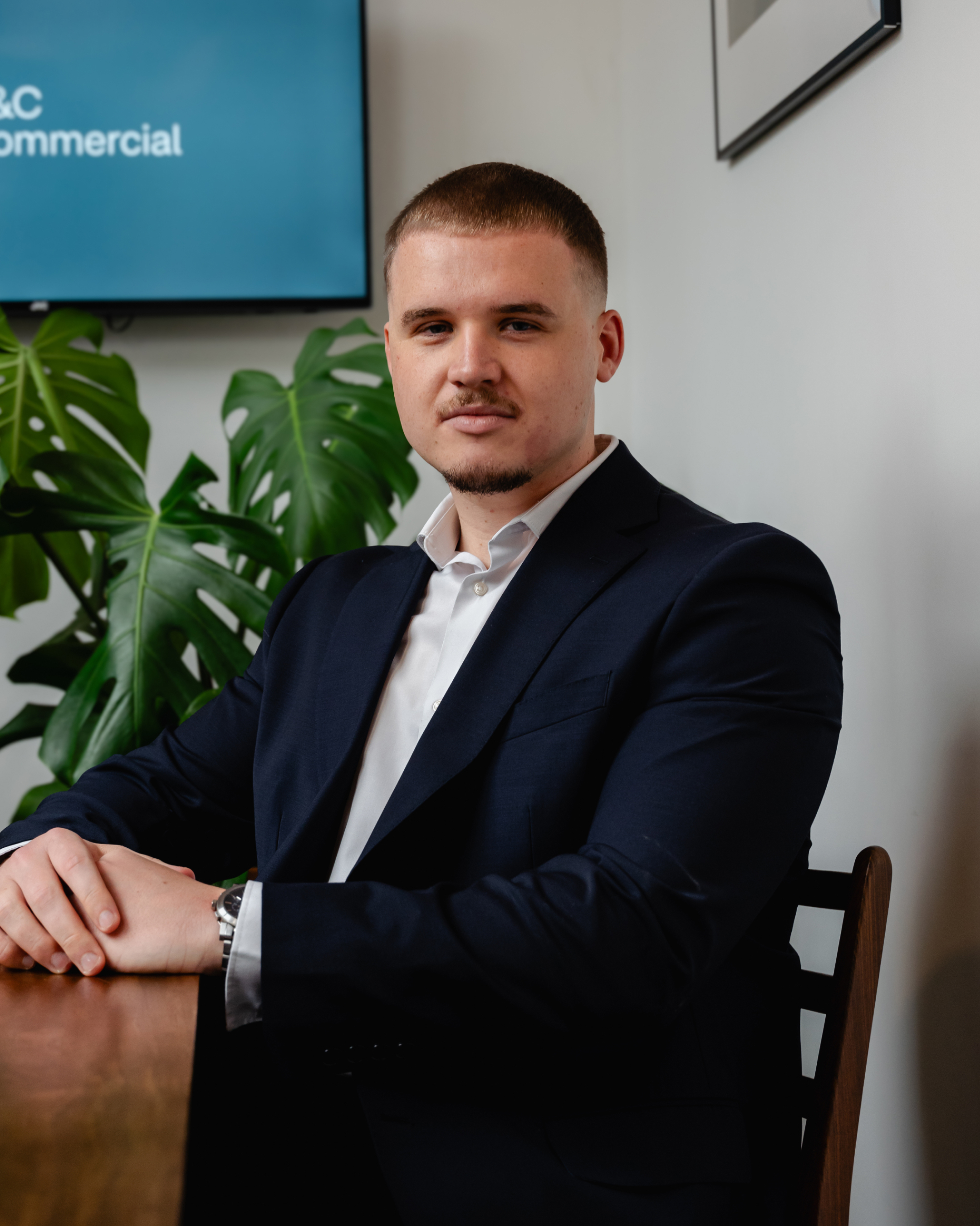 Jamie Atkinson wearing smart clothes against a plain background