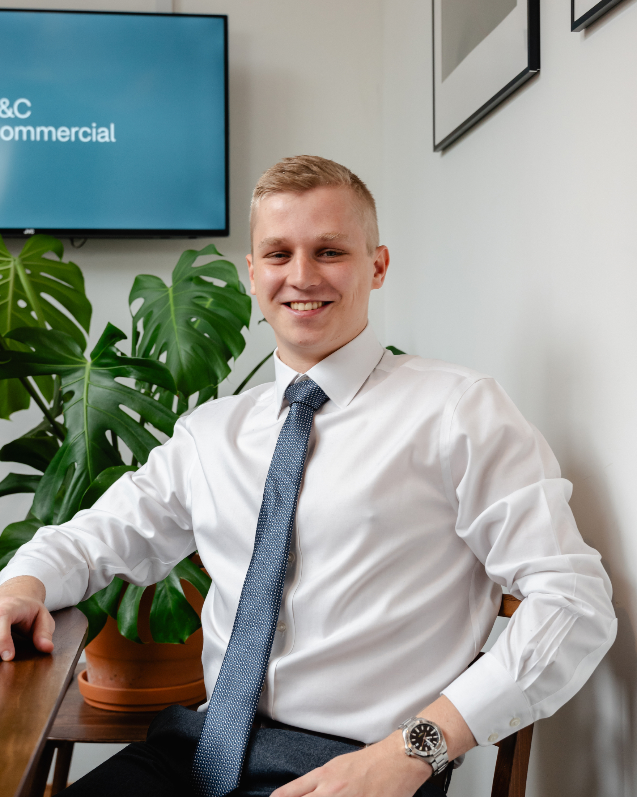 Sam Walsh wearing smart clothes against a plain background